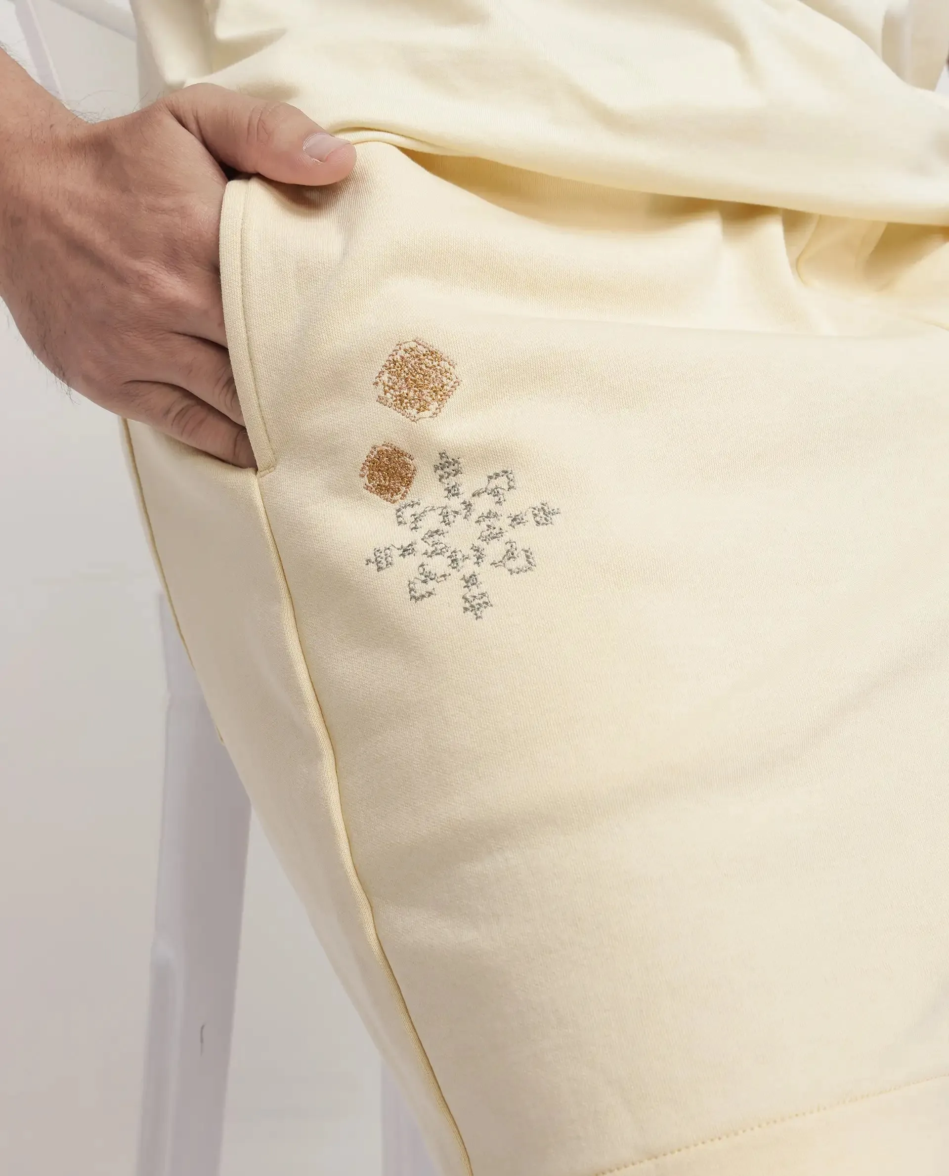 Rare Rabbit Men Enox Pastel Yellow Cotton Elastane Fabric Plain Shorts