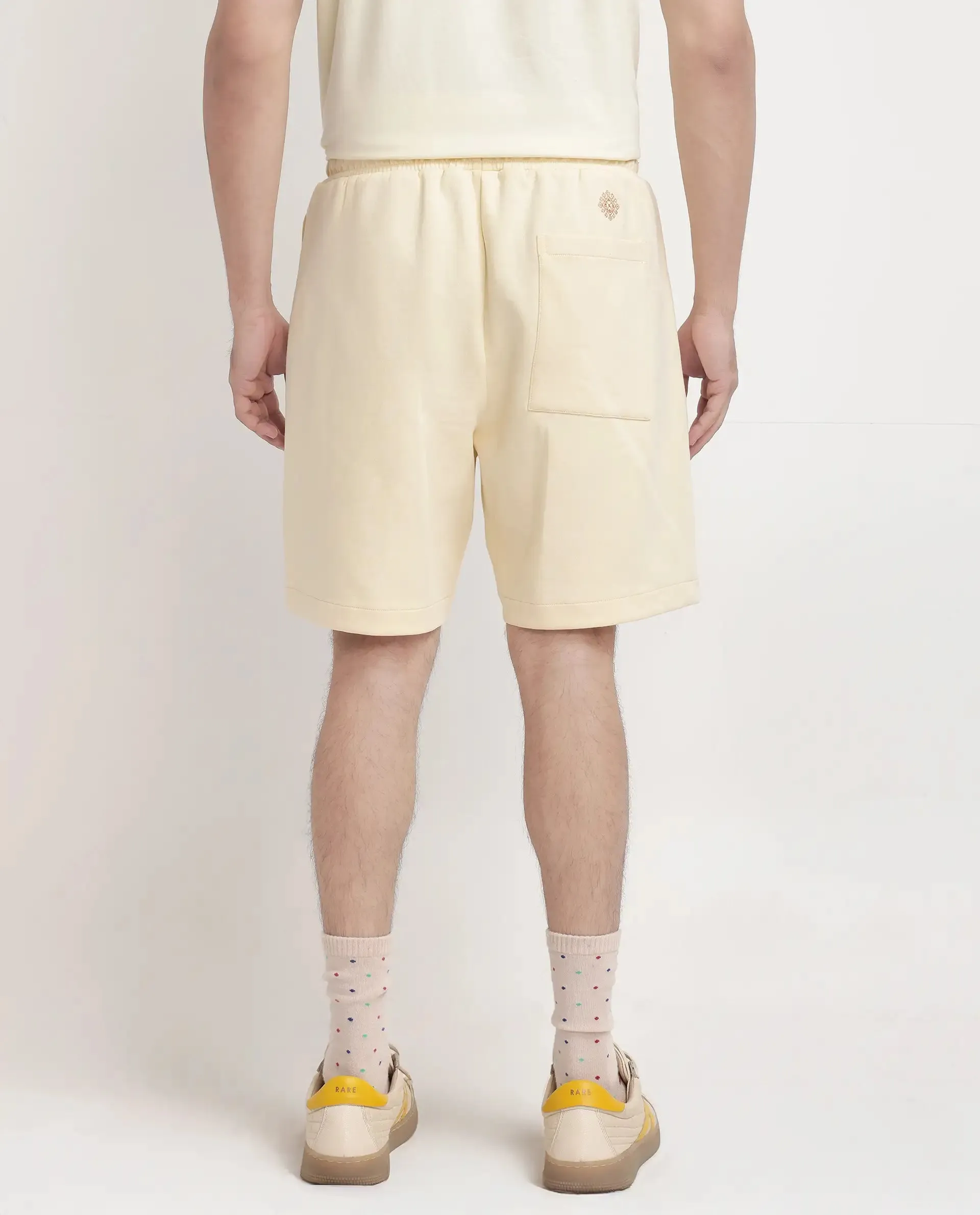 Rare Rabbit Men Enox Pastel Yellow Cotton Elastane Fabric Plain Shorts