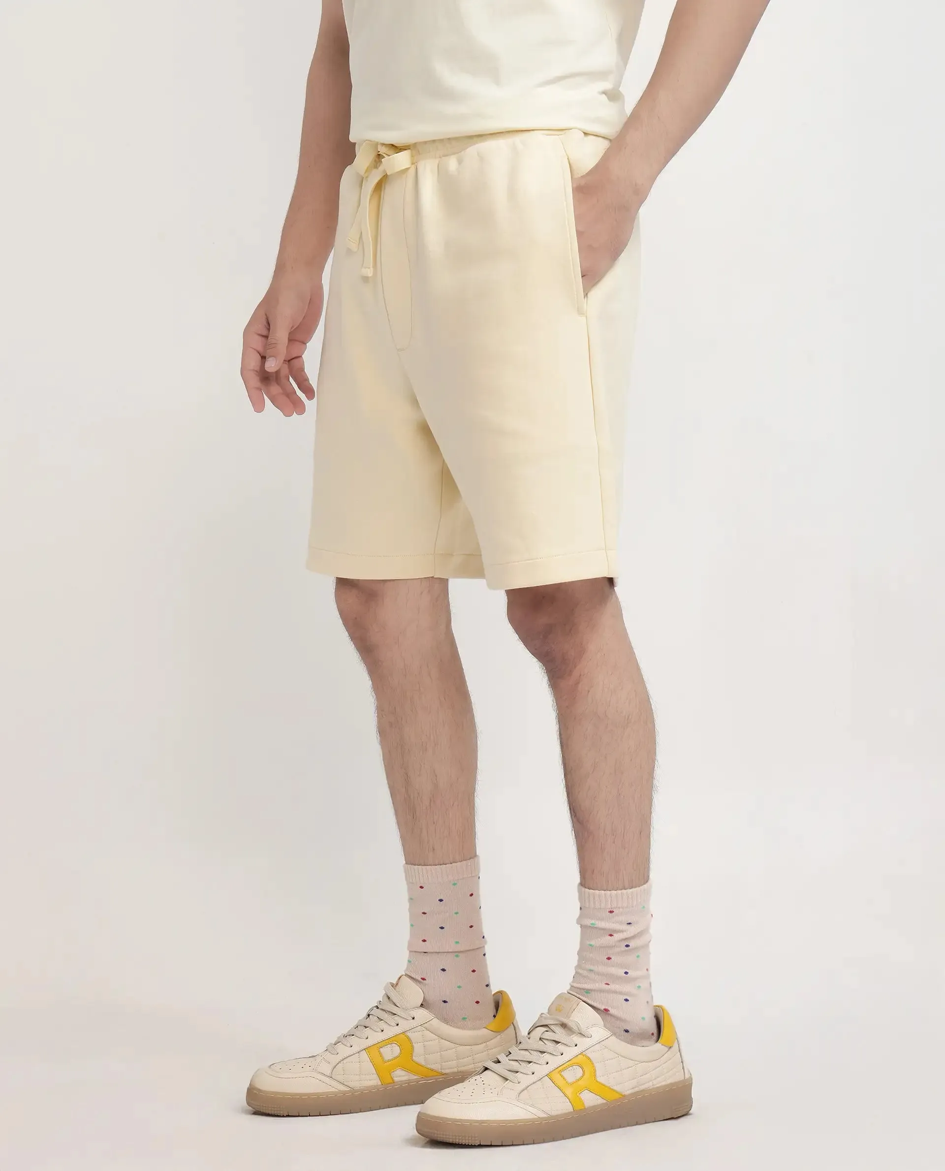 Rare Rabbit Men Enox Pastel Yellow Cotton Elastane Fabric Plain Shorts