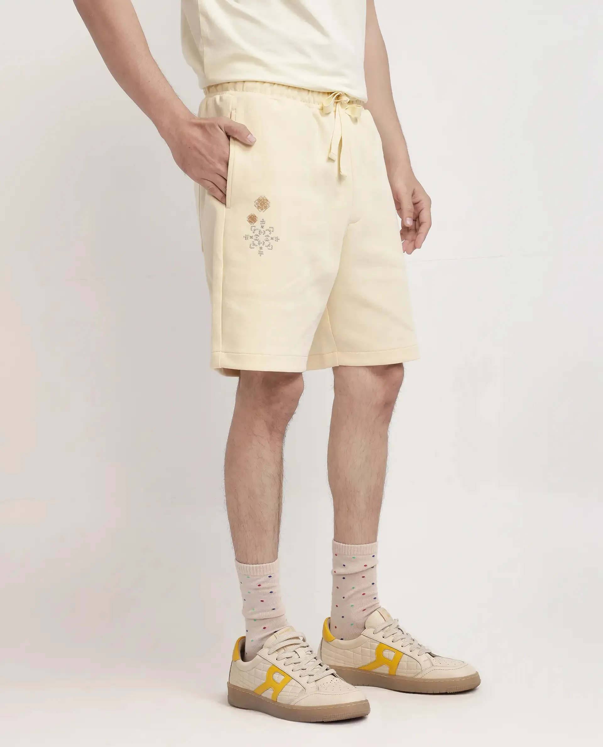 Rare Rabbit Men Enox Pastel Yellow Cotton Elastane Fabric Plain Shorts